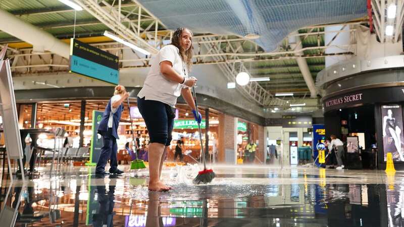 Faro Airport has been flooded in the rains (Image: PA)