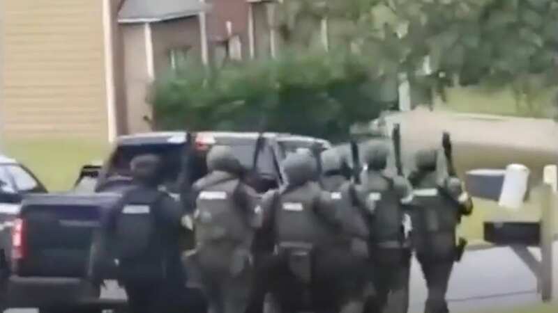 Moment SWAT raids home and arrests people running 