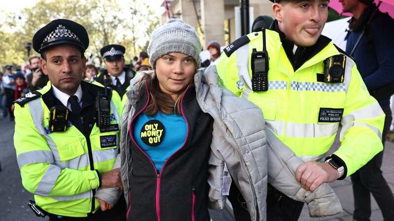 Swedish climate activist Greta Thunberg is arrested by police outside the InterContinental London Park Lane (Image: AFP via Getty Images)