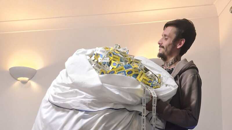 Philly Jones with a bedsheet full of arcade tickets won at Butlin