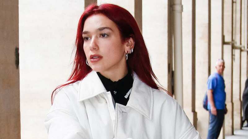 Dua Lipa ditches her signature locks for fiery red style on Paris outing