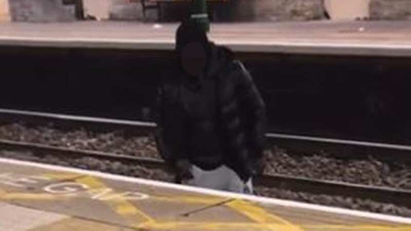 The man can be seen crossing the tracks in the footage (Image: TikTok)