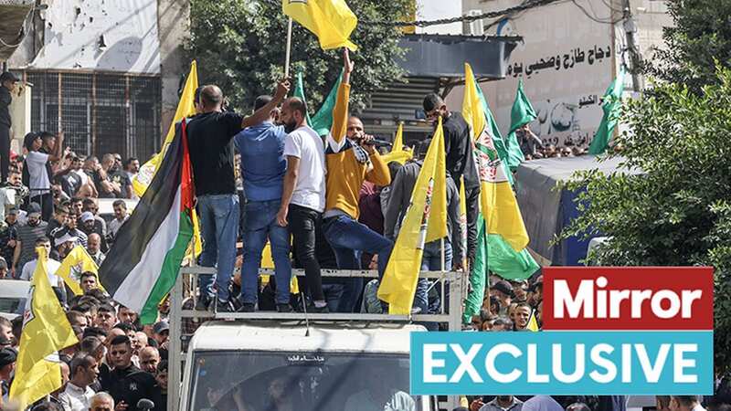 Thousands of angry mourners bury two Palestinians shot dead