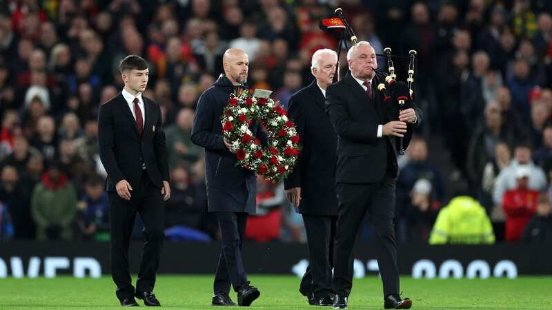 Erik ten Hag (centre) carried the wreath onto the pitch, alongside Dan Gore (left) and Alex Stepney (right) (Image: Catherine Ivill/Getty Images)