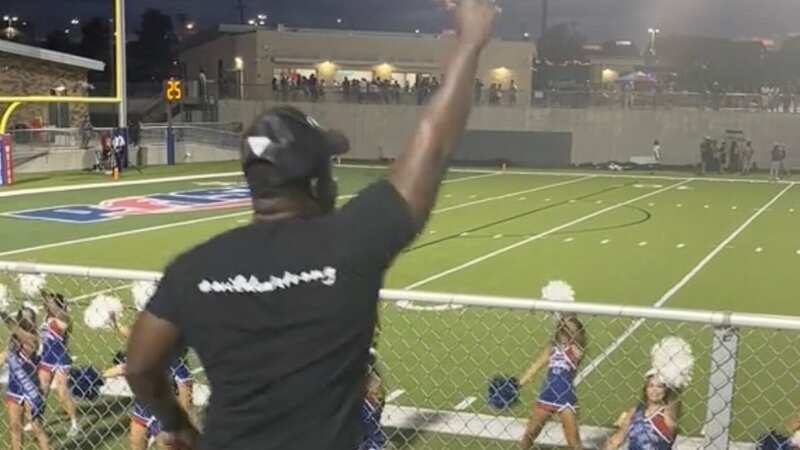 Dad goes viral mimicking daughter’s cheerleading routine from sideline