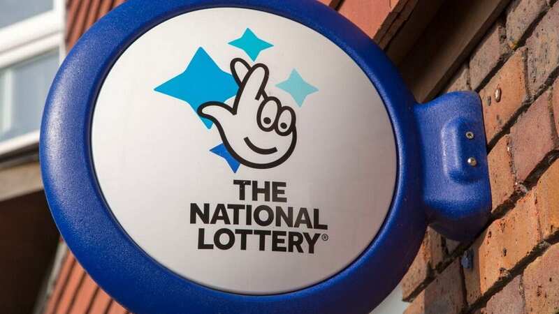 A wall mounted sign for the National Lottery is pictured in Wiltshire (Image: Universal Images Group via Getty Images)