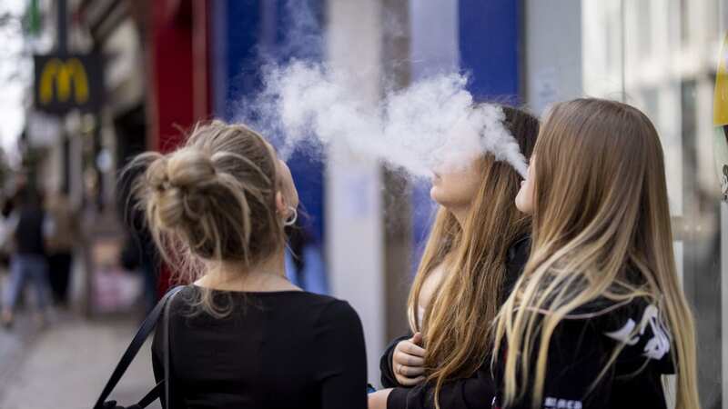 A group of young people use vapes on a street (file image) (Image: TOLGA AKMEN/EPA-EFE/REX/Shutterstock)