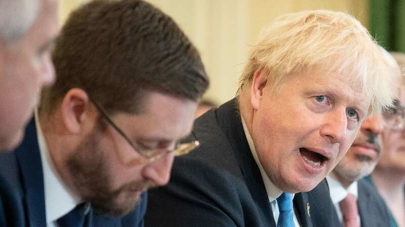 Simon Case (left) criticised Boris Johnson in secret WhatsApp messages (Image: Getty Images)