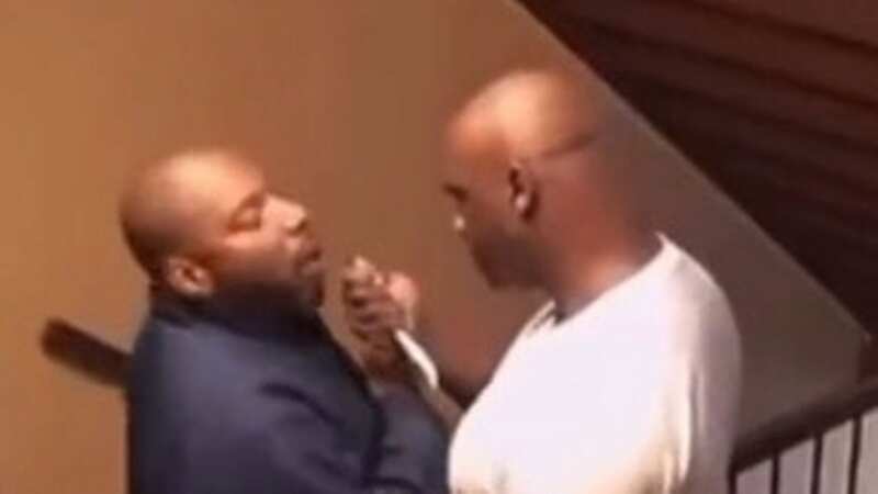 Horrific moment neighbour guns down stepfather and stepson outside flat