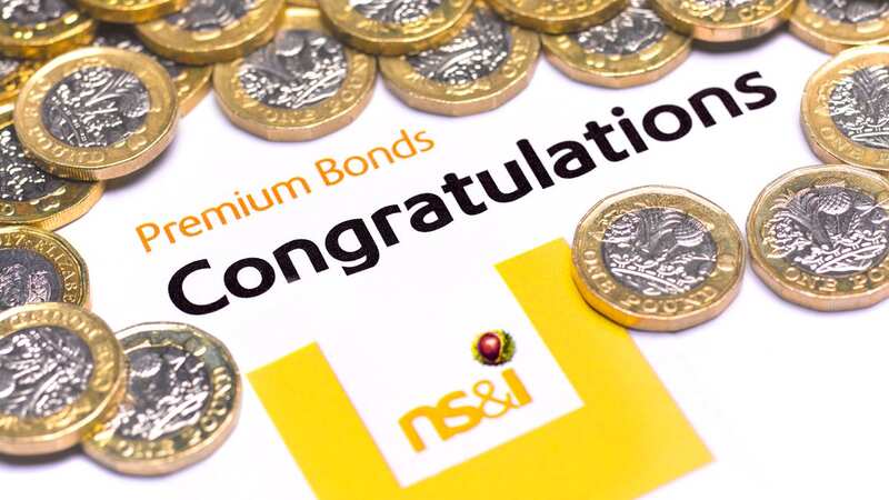 Premium Bond congratulatory note and pound coins (Image: Getty Images)