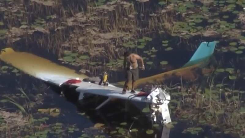 The man was left stranded on the wing of the mostly submerged plane (Image: NBC)