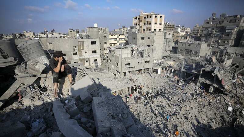 A survivor in the ruins of Bureij refugee camp (Image: Anadolu via Getty Images)