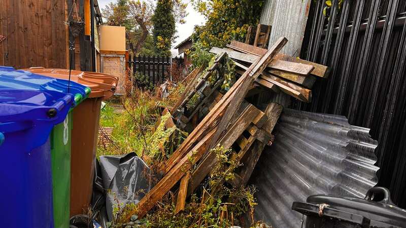 The neighbours row centres around a pathway that runs between their homes (Image: STEVE ALLEN)