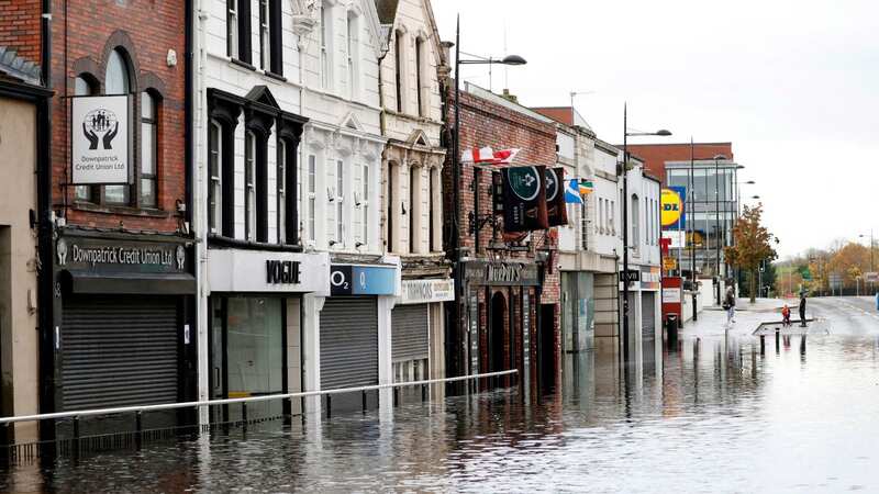 Flooded shops in the town centre after flooding in Downpatrick, Northern Ireland (Image: PA)