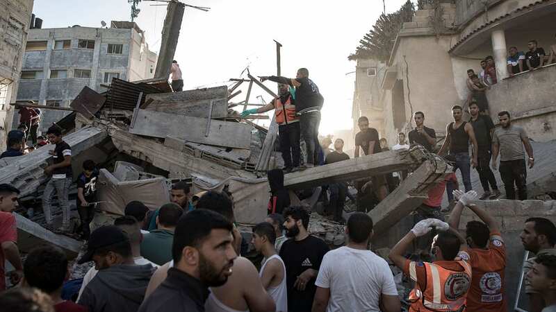 Palestinians have searched for bodies and survivors among the rubble of a residential building following an Israeli airstrike (Image: HAITHAM IMAD/EPA-EFE/REX/Shutterstock)