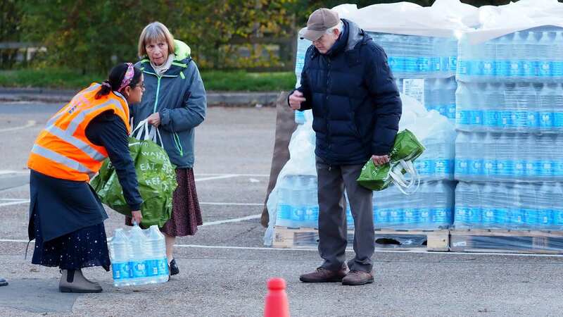 Bottles of water have been handed out to residents in Godalming, Surrey, after a major water outage over the weekend (Image: PA)