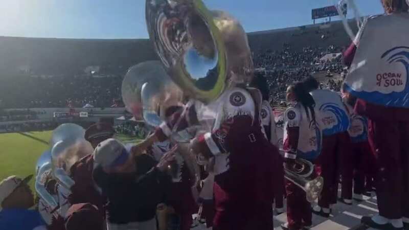 College TUBA player punches ranting heckler in face knocking him out in stands