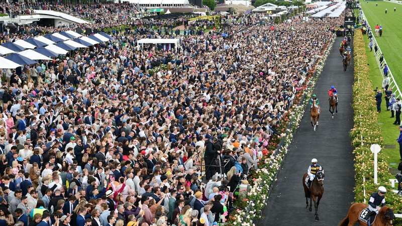 MELBOURNE, AUSTRALIA - NOVEMBER 01: General view of crowd as horses walk onto the track before Race 7, the Lexus Melbourne Cup, during 2022 Lexus Melbourne Cup Day at Flemington Racecourse on November 01, 2022 in Melbourne, Australia. (Photo by Vince Caligiuri/Getty Images)