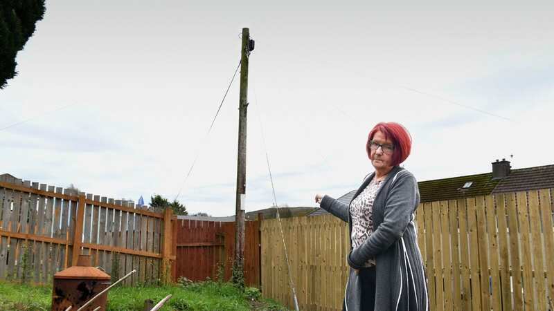 Ellen Ballantyne is unhappy with the mast in her back garden (Image: Greenock Telegraph / SWNS)