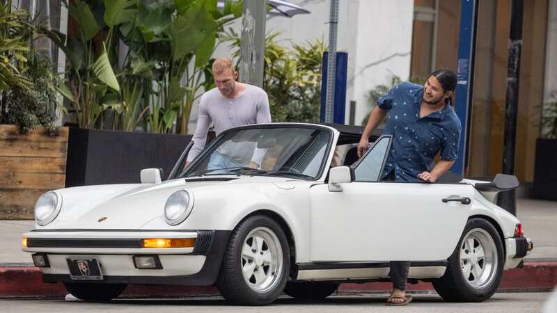 Edwin Castro with a vintage Porsche (Image: Diggzy/Jesal / SplashNews.com)