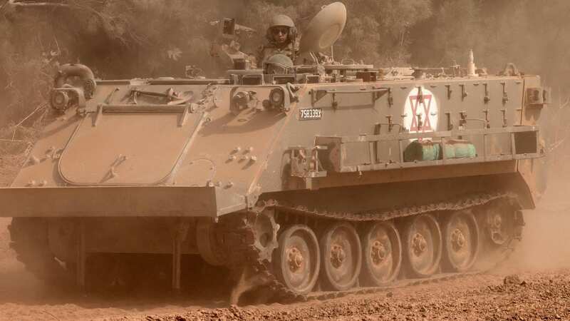 An Israeli army tracked medical vehicle moves in a military convoy (Image: AFP via Getty Images)