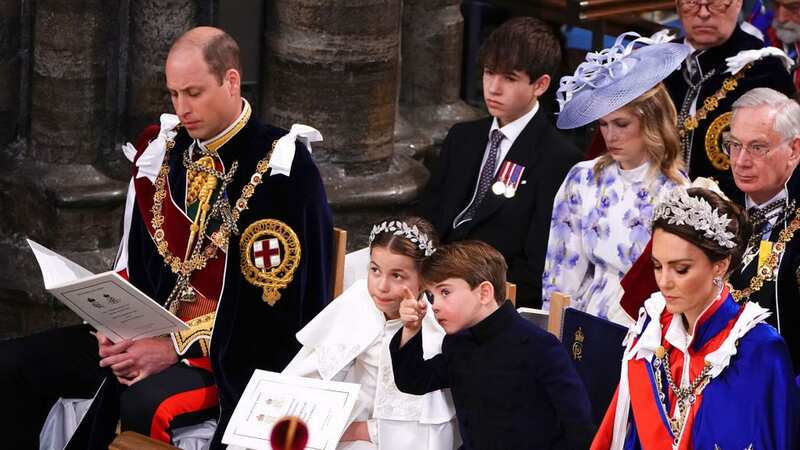 Prince Louis was seen pointing at something overhead and telling his sister Charlotte about it (Image: Getty Images)