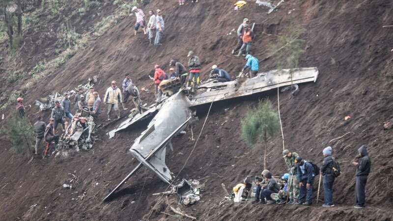 The horrific wreckage of a crash that saw four people killed (Image: AFP via Getty Images)