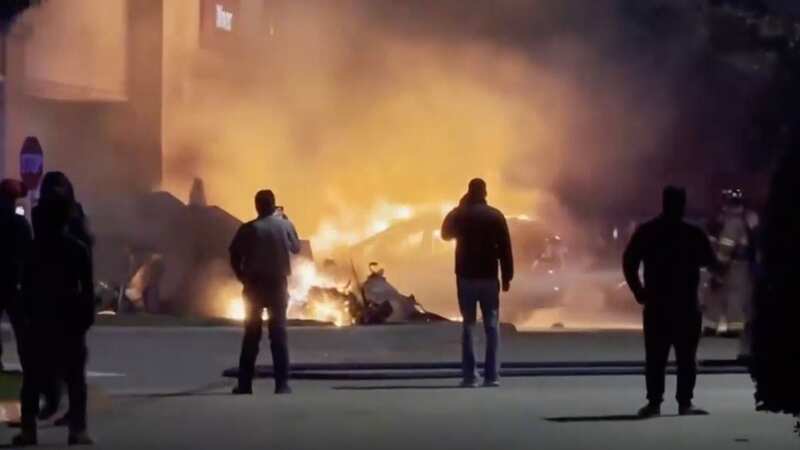 Plane crashes into shopping centre as it is engulfed in flames killing pilot