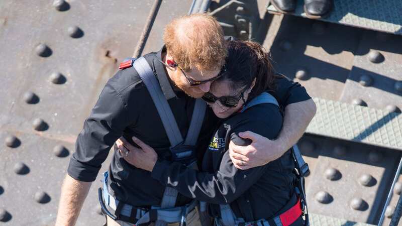 Prince Harry and widow Gwen Cherne spent ten minutes chatting and even shared an emotional hug (Image: DAILY MIRROR)