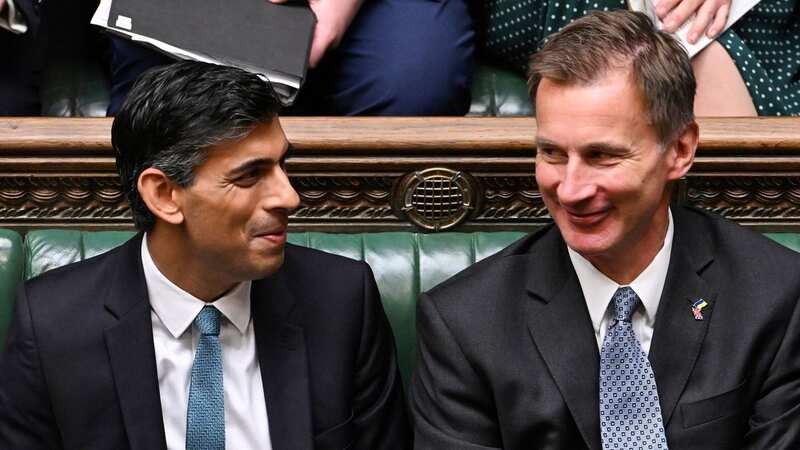 Rishi Sunak and Jeremy Hunt appear to be doing all they can to cling onto power (Image: AFP via Getty Images)