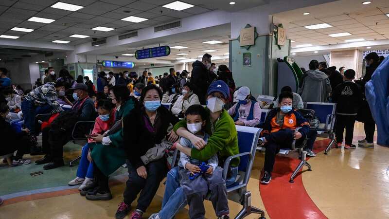 China is suffering from a new mystery virus which is overwhelming its hospitals (Image: AFP via Getty Images)