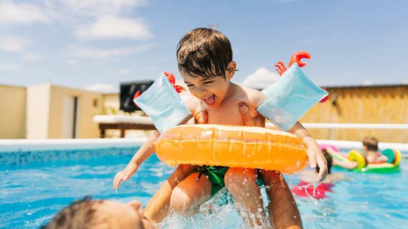 Save money on your next family holiday (Image: Getty)