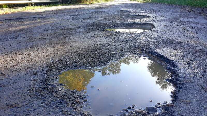 The cost of repairing potholes is estimated at £14billion (Image: Getty Images)