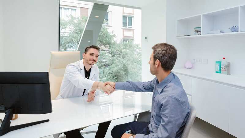A patient having a consultation at Capilclinic