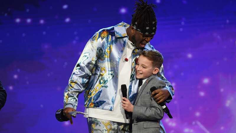 Young Hughie receives a Pride of Britain award (Image: Rowan Griffiths / Daily Mirror)