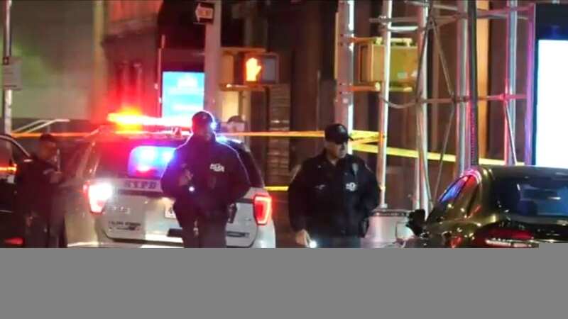 Police at the scene of the double stabbing in Lafayette Street in New York (Image: WABC)