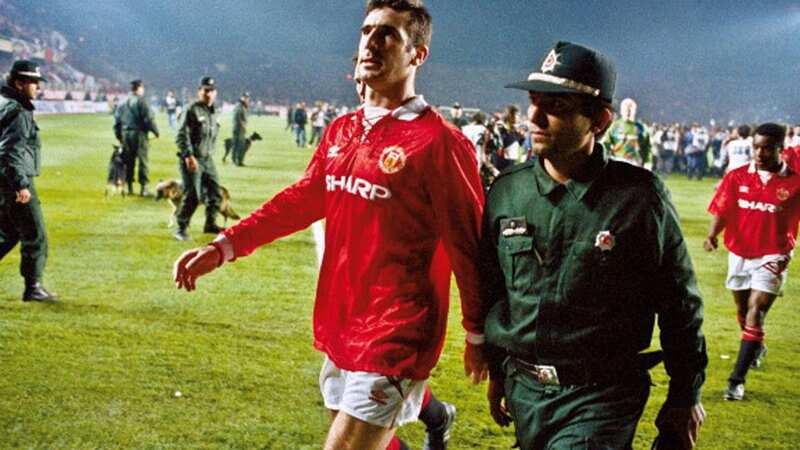 Manchester United player Eric Cantona is escorted from the pitch by a policeman after he was sent off at the end of the Champions League second round match with Galatasaray at the Ali Sami Yen stadium in 1993 (Image: Getty)