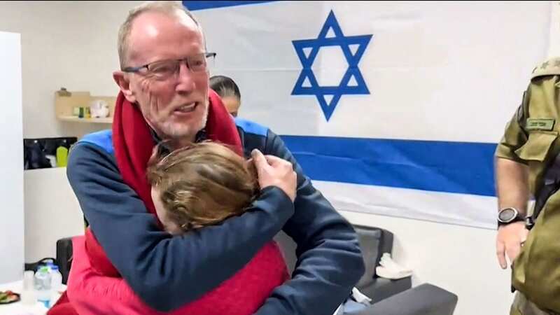 Former hostage Emily Hand, aged nine, is reunited with father Tom (Image: Israel Army/AFP via Getty Images)