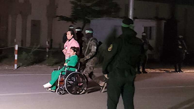 Moment Hamas fighters return boy in wheelchair 51 days after hostage hell began