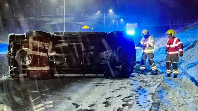 Moment man tries to cross M5 after pick-up truck overturns with three inside