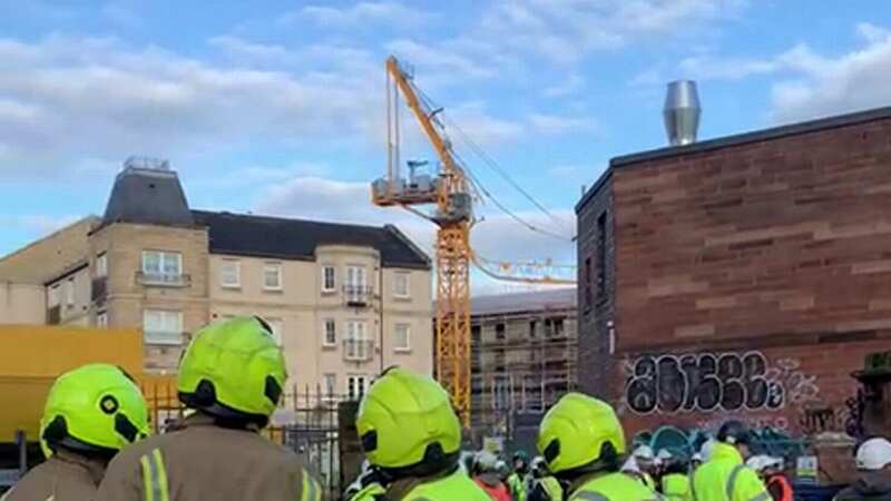 Horror as crane collapses onto block of flats as person rushed to hospital