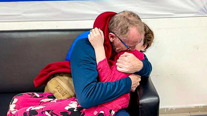 Thomas Hand hugging his daughter Emily (Image: Israel Army/AFP via Getty Images)