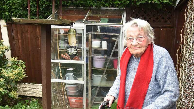 Frail Anne Seago, 97, in her garden in Blackpool where she likes to feed the birds (Image: CHRIS NEILL)