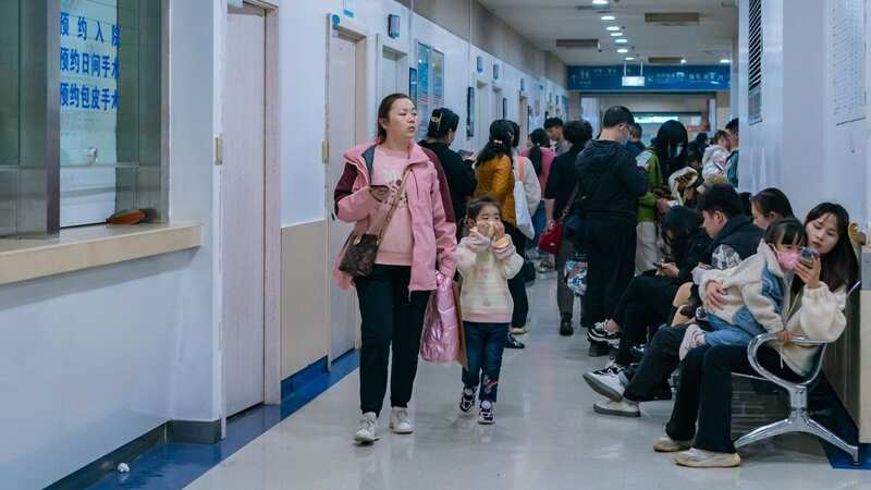 China has brought social distancing and mask-wearing back as it deals with a mystery viral outbreak (Image: Costfoto/NurPhoto/REX/Shutterstock)