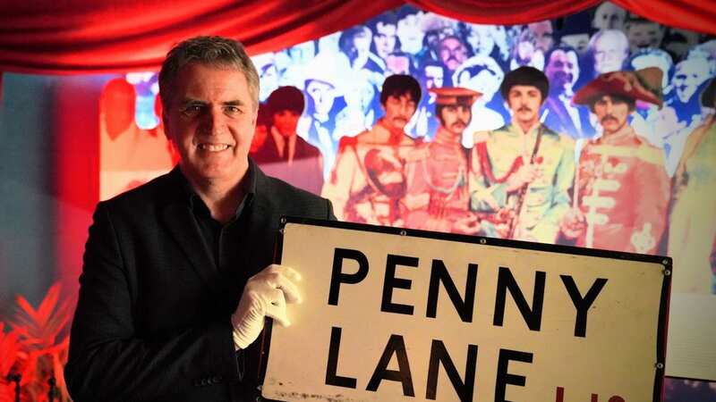Mayor Steve Rotheram with the sign (Image: PA)