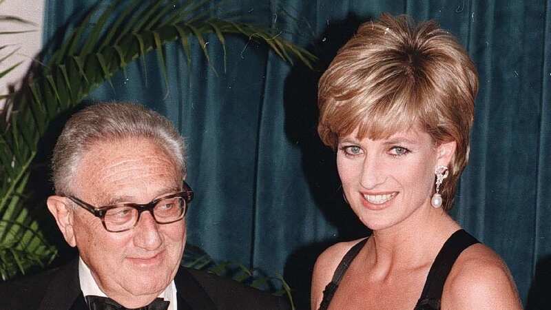 Henry Kissinger presents Princess Dianawith an award in 1995 (Image: PA)