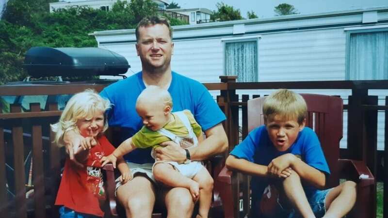 Kevin Lewis, pictured with three of his four children, died of cardiac arrest while having a massage (Image: BHF)