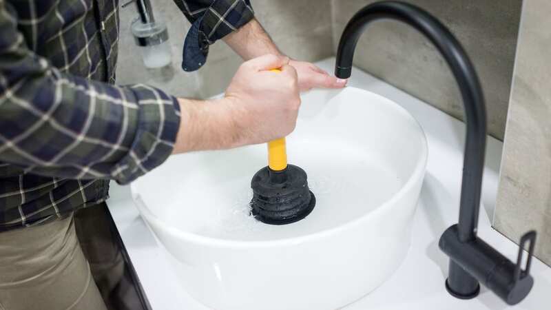 Fixing a blocked drain could set you back as much as £240 (Image: Getty Images)