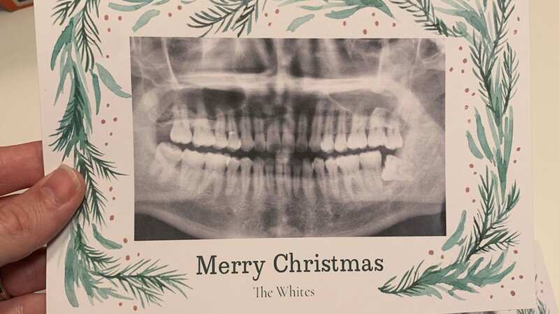 Instead of a festive family portrait or snowy scene, the "Christmas card" showed an eerie looking x-ray - hilariously surrounded by holly clipart (Image: Jam Press/@atdanwhite)