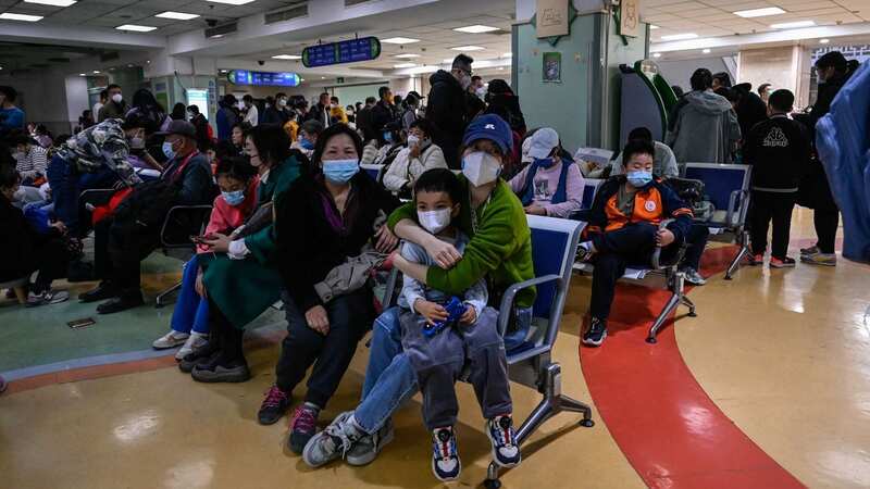 China is being overwhelmed by respiratory problems thought to be linked to a new virus (Image: AFP via Getty Images)